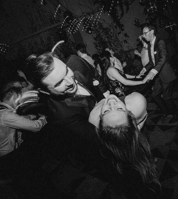 A couple dancing together at their reception